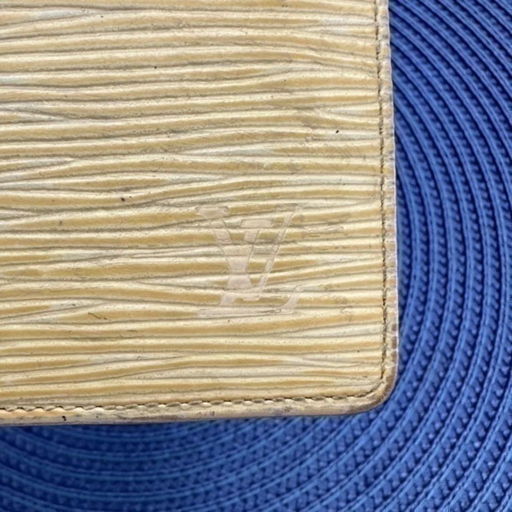 AUTHENTIC Louis Vuitton Marco Wallet. Previously owned. Light yellow.